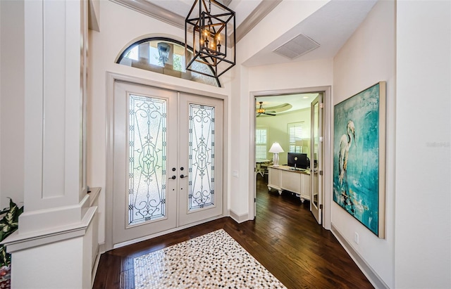 1012 Tuscany Dr, Trinity, FL 34655 - foyer entrance with french doors, dark wood-style flooring, and a chandelier