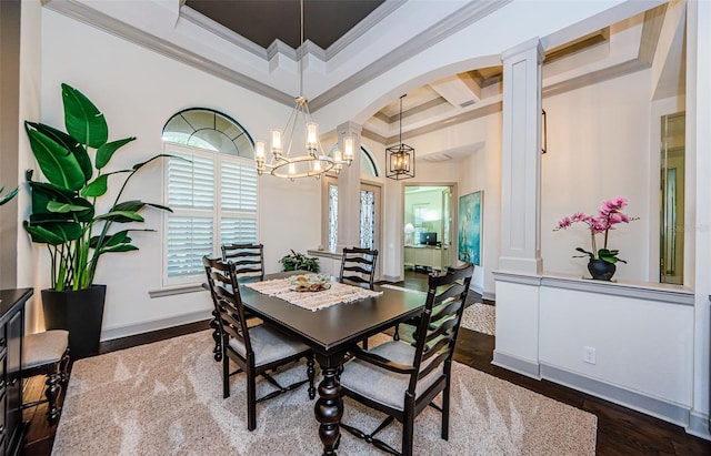 1012 Tuscany Dr, Trinity, FL 34655 - dining area with coffered ceiling, crown molding, a chandelier, ornate columns, and wood finished floors