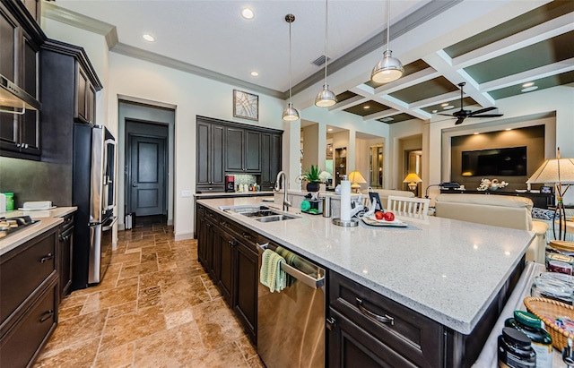 1012 Tuscany Dr, Trinity, FL 34655 - kitchen with appliances with stainless steel finishes, ceiling fan, stone tile flooring, open floor plan, and a large island