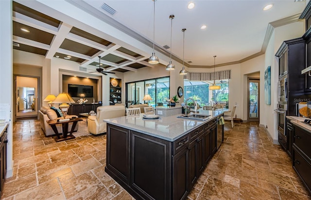 1012 Tuscany Dr, Trinity, FL 34655 - kitchen featuring stone tile flooring, stainless steel oven, a ceiling fan, recessed lighting, and beamed ceiling