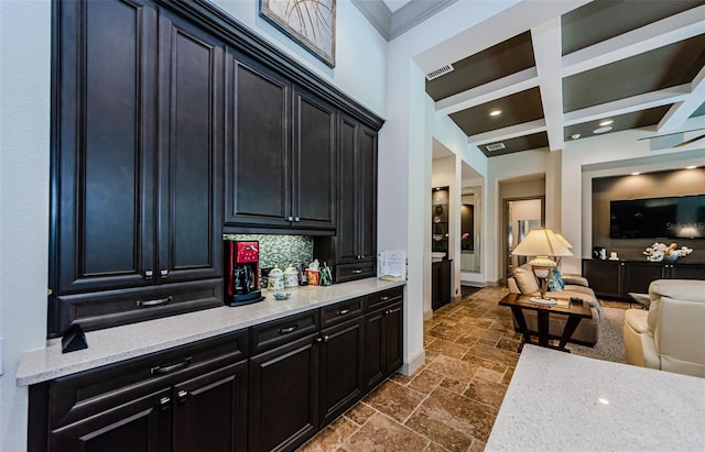 1012 Tuscany Dr, Trinity, FL 34655 - bar area with stone tile floors, beamed ceiling, coffered ceiling, recessed lighting, and crown molding