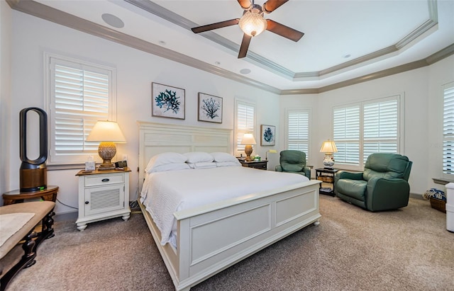 1012 Tuscany Dr, Trinity, FL 34655 - bedroom with ornamental molding, carpet, a tray ceiling, multiple windows, and ceiling fan
