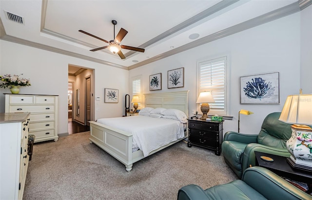 1012 Tuscany Dr, Trinity, FL 34655 - bedroom featuring light carpet, a tray ceiling, multiple windows, and ornamental molding