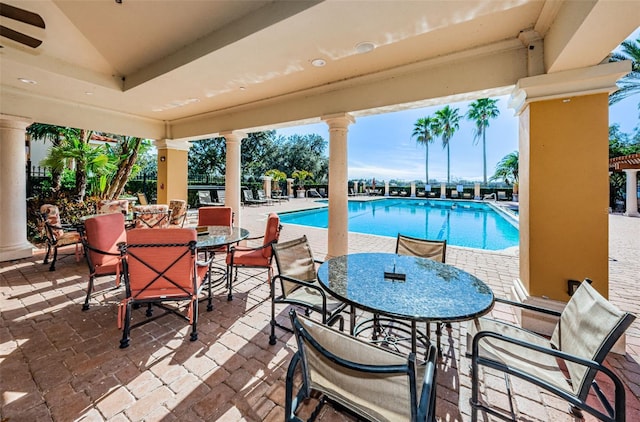 1012 Tuscany Dr, Trinity, FL 34655 - community pool with outdoor dining area and a patio area