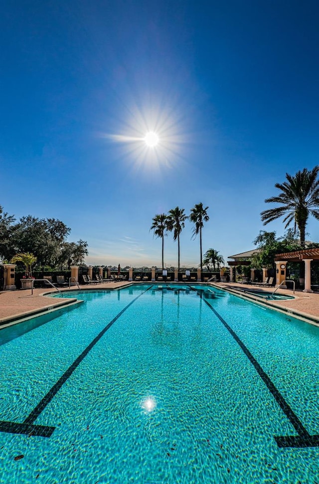 1012 Tuscany Dr, Trinity, FL 34655 - community pool featuring a patio area