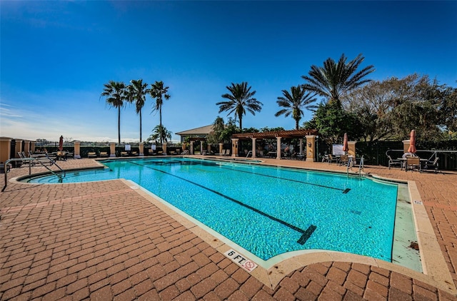1012 Tuscany Dr, Trinity, FL 34655 - community pool featuring a patio and a pergola