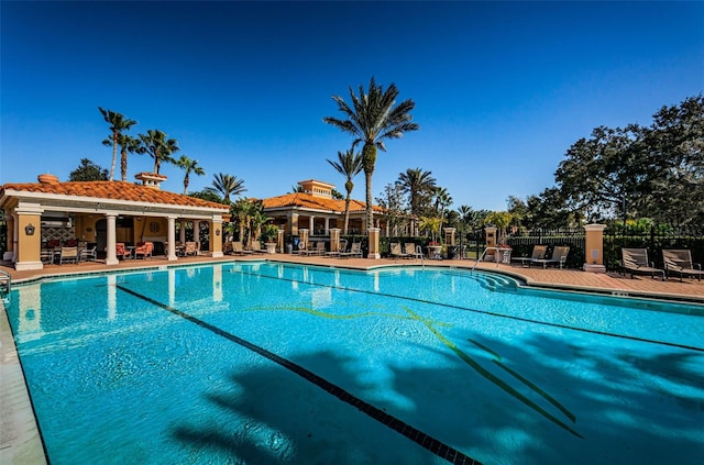 1012 Tuscany Dr, Trinity, FL 34655 - community pool featuring a patio