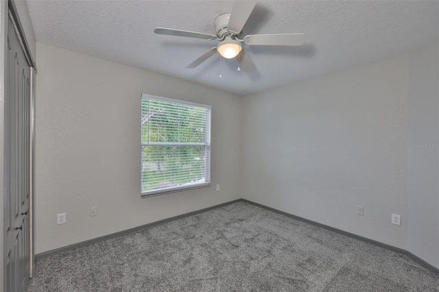 3633 Springville Dr, Valrico, FL 33596 - spare room featuring carpet, a textured ceiling, a ceiling fan, and baseboards