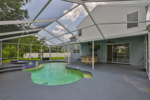 3633 Springville Dr, Valrico, FL 33596 - view of swimming pool featuring a patio, a ceiling fan, a pool with connected hot tub, and glass enclosure