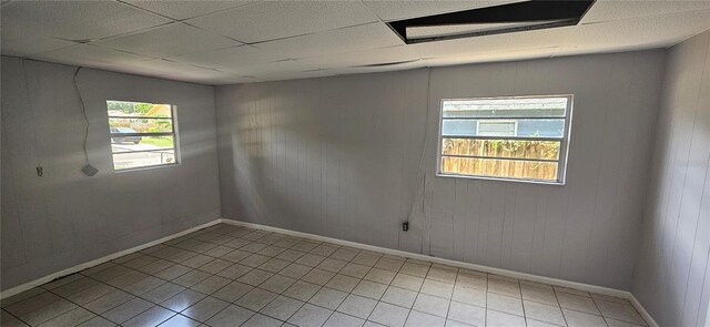 2503 Elm St, Seffner, FL 33584 - spare room featuring baseboards, tile patterned floors, and a drop ceiling