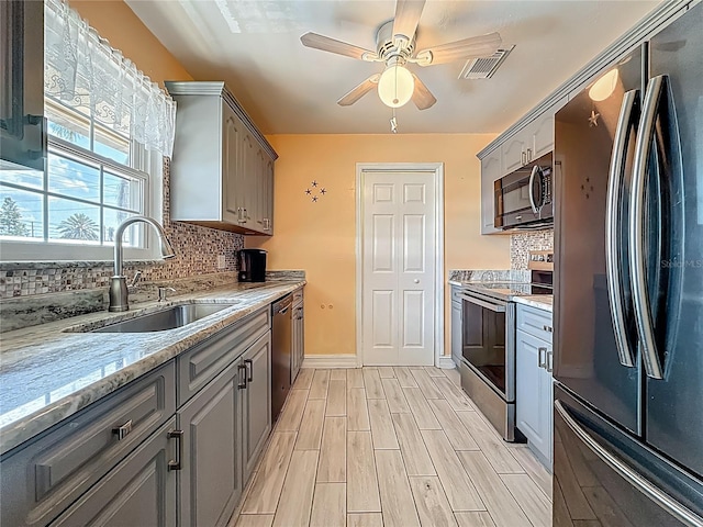 200 Country Club Dr Unit 202, Largo, FL 33771 - kitchen featuring stainless steel appliances, gray cabinets, and a sink