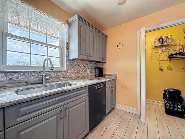 200 Country Club Dr Unit 202, Largo, FL 33771 - kitchen featuring gray cabinetry, black dishwasher, a sink, and tasteful backsplash