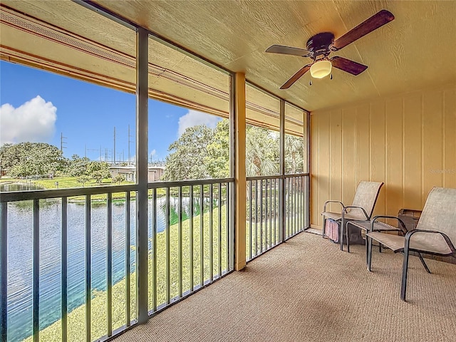 200 Country Club Dr Unit 202, Largo, FL 33771 - unfurnished sunroom with a water view, ceiling fan, and plenty of natural light