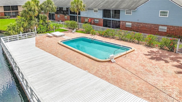 200 Country Club Dr Unit 202, Largo, FL 33771 - community pool featuring a patio