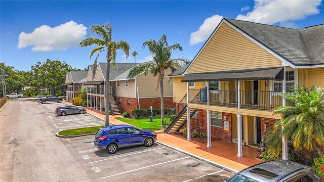 200 Country Club Dr Unit 202, Largo, FL 33771 - view of jungle gym featuring stairs and a residential view