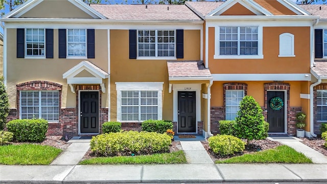 12464 Berkeley Square Dr, Tampa, FL 33626 - view of property featuring brick siding and stucco siding