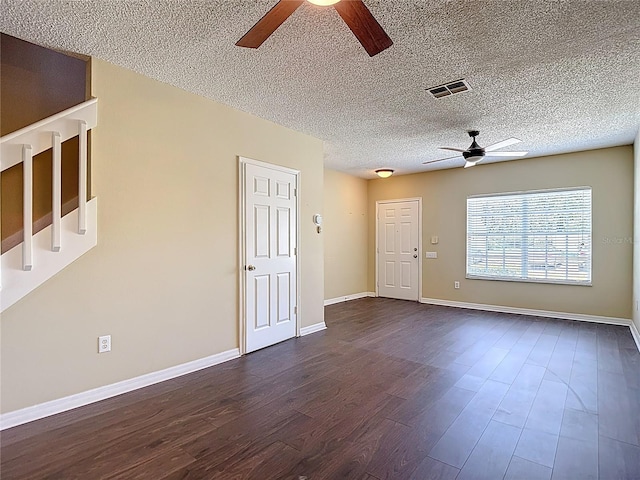 12464 Berkeley Square Dr, Tampa, FL 33626 - unfurnished living room featuring a ceiling fan, dark wood finished floors, and a textured ceiling