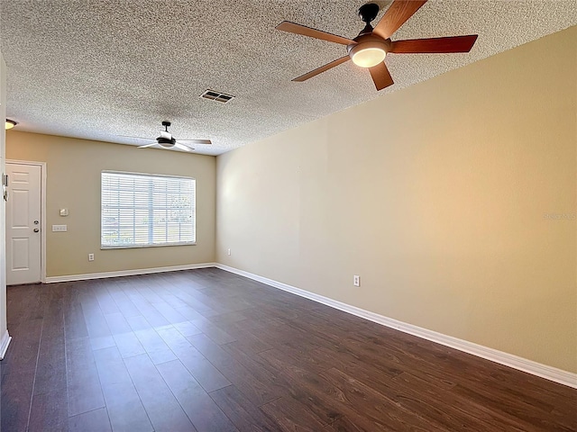 12464 Berkeley Square Dr, Tampa, FL 33626 - spare room featuring a ceiling fan, dark wood finished floors, and a textured ceiling