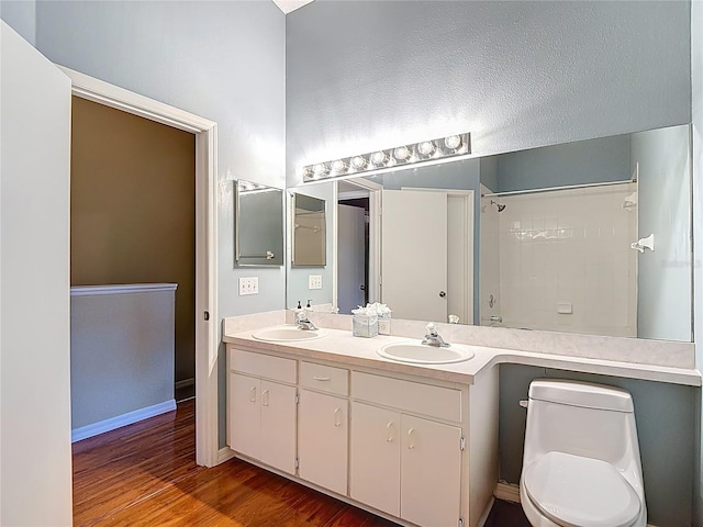 12464 Berkeley Square Dr, Tampa, FL 33626 - full bath with double vanity, wood finished floors, and a shower