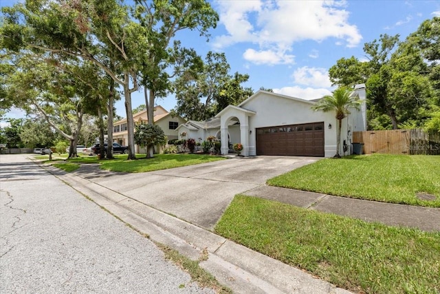 6051 65th Ave N, Pinellas Park, FL 33781 - view of front of house featuring a garage, concrete driveway, and stucco siding