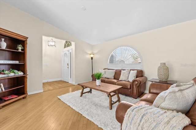 6051 65th Ave N, Pinellas Park, FL 33781 - living area with light wood finished floors and lofted ceiling
