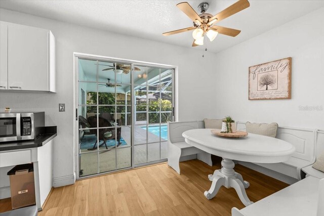 6051 65th Ave N, Pinellas Park, FL 33781 - dining area with ceiling fan and light wood-style floors