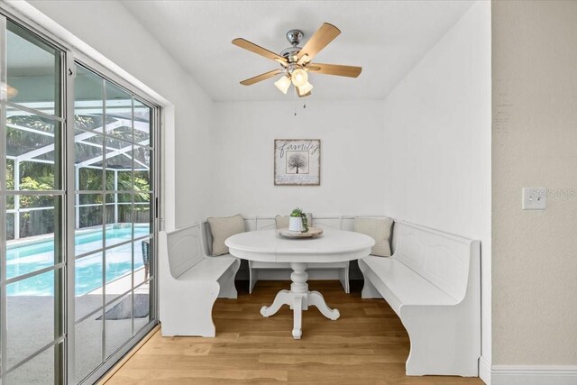 6051 65th Ave N, Pinellas Park, FL 33781 - dining room with breakfast area, light wood-type flooring, and a ceiling fan