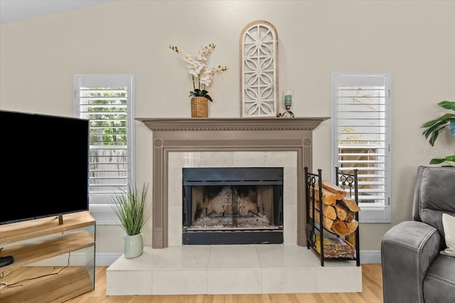 6051 65th Ave N, Pinellas Park, FL 33781 - living room with a tile fireplace and wood finished floors