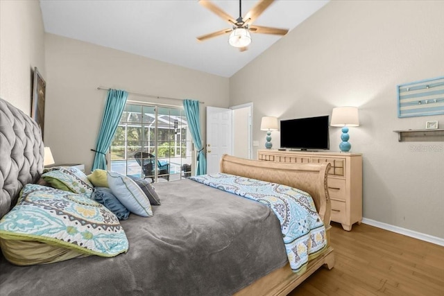 6051 65th Ave N, Pinellas Park, FL 33781 - bedroom featuring wood finished floors, access to outside, high vaulted ceiling, and ceiling fan