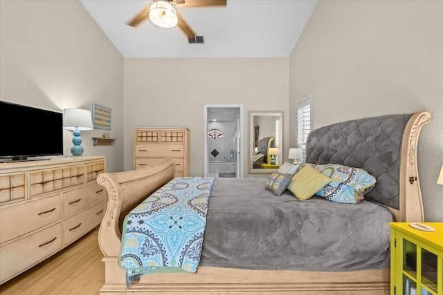 6051 65th Ave N, Pinellas Park, FL 33781 - bedroom with light wood-style floors, vaulted ceiling, and ceiling fan