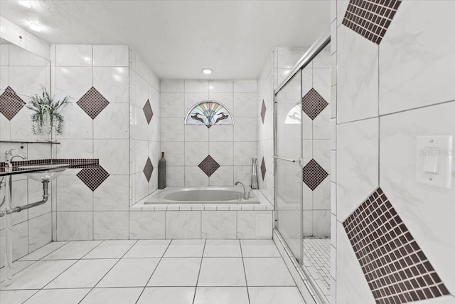 6051 65th Ave N, Pinellas Park, FL 33781 - full bathroom with a garden tub, a shower stall, tile walls, and tile patterned floors