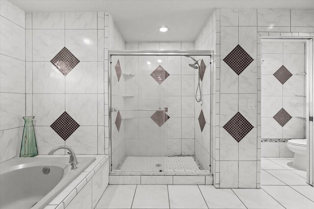 6051 65th Ave N, Pinellas Park, FL 33781 - bathroom with a garden tub, a shower stall, recessed lighting, tile patterned floors, and tile walls
