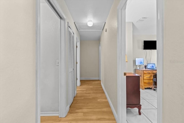 6051 65th Ave N, Pinellas Park, FL 33781 - hallway with light wood-type flooring and a textured wall