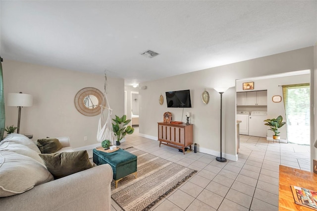 3371 N Bay Ave, Crystal River, FL 34428 - living area featuring independent washer and dryer and light tile patterned floors