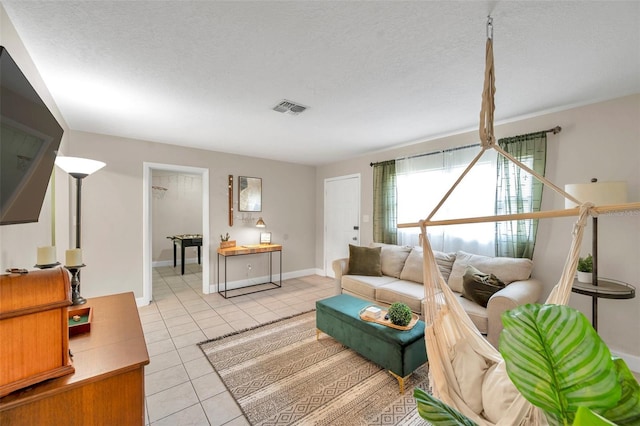 3371 N Bay Ave, Crystal River, FL 34428 - living room with light tile patterned floors and a textured ceiling