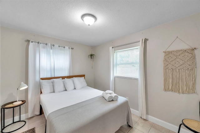 3371 N Bay Ave, Crystal River, FL 34428 - bedroom featuring light tile patterned floors and a textured ceiling