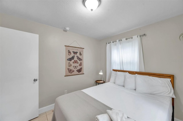3371 N Bay Ave, Crystal River, FL 34428 - bedroom with light tile patterned floors and a textured ceiling