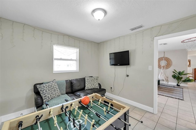 3371 N Bay Ave, Crystal River, FL 34428 - living area featuring light tile patterned floors and a textured ceiling