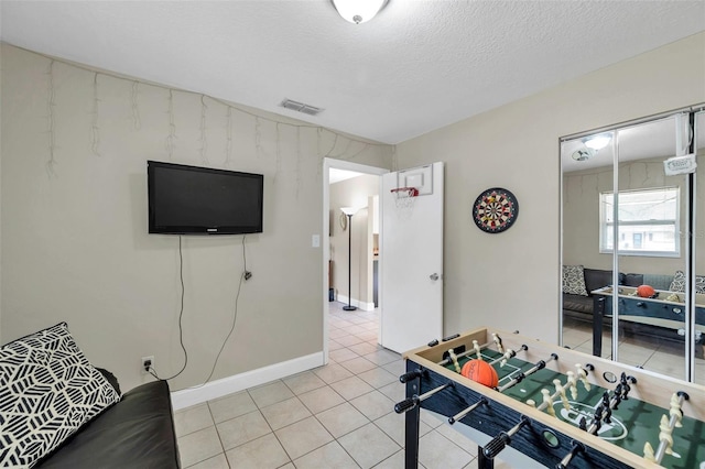 3371 N Bay Ave, Crystal River, FL 34428 - rec room with light tile patterned floors and a textured ceiling