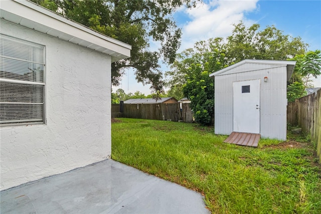 4318 Mesa Dr, New Port Richey, FL 34653 - fenced backyard with a shed and a patio