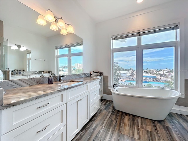 1204 Derby Ln, Sarasota, FL 34242 - bathroom with a freestanding bath and vanity