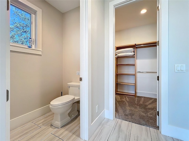 1204 Derby Ln, Sarasota, FL 34242 - bathroom with baseboards and toilet