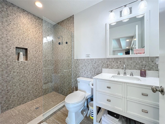 1204 Derby Ln, Sarasota, FL 34242 - bathroom with vanity, tile walls, a stall shower, and toilet