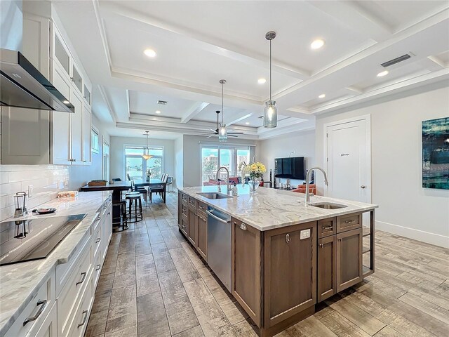 1204 Derby Ln, Sarasota, FL 34242 - kitchen with wall chimney exhaust hood, a sink, dishwasher, coffered ceiling, and light wood-style floors