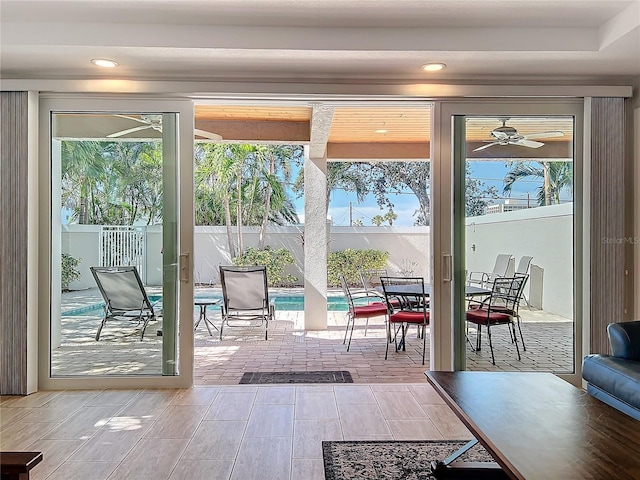 1204 Derby Ln, Sarasota, FL 34242 - doorway to outside with a ceiling fan, plenty of natural light, and recessed lighting