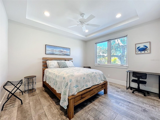 1204 Derby Ln, Sarasota, FL 34242 - bedroom featuring a raised ceiling, hardwood / wood-style flooring, recessed lighting, baseboards, and ceiling fan