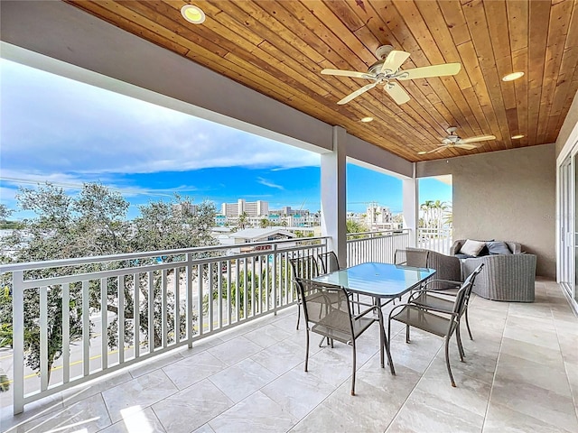 1204 Derby Ln, Sarasota, FL 34242 - balcony with a ceiling fan, outdoor dining space, and a view of city