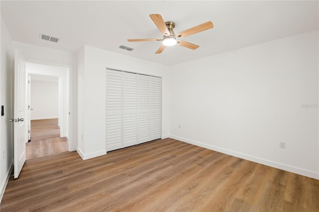 10219 Huntley St, New Port Richey, FL 34654 - unfurnished bedroom with light wood-type flooring, a closet, and a ceiling fan