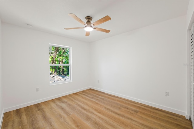 10219 Huntley St, New Port Richey, FL 34654 - unfurnished room with ceiling fan, light wood-style floors, and a smoke detector