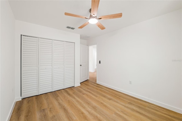 10219 Huntley St, New Port Richey, FL 34654 - unfurnished bedroom featuring light wood finished floors, a closet, and ceiling fan